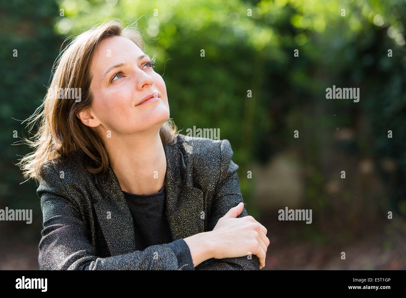 Woman resting outdoors. Stock Photo