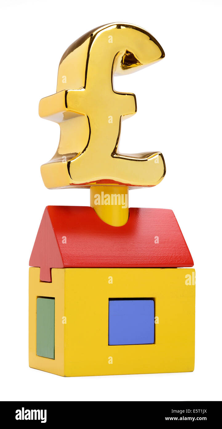 A toy wooden house with a £ pound symbol on top Stock Photo