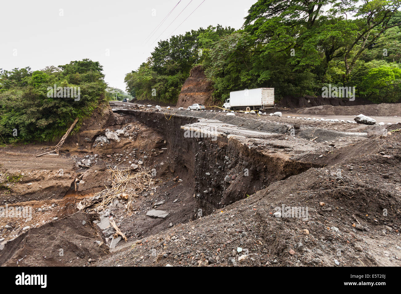 Landslide of a road after flooding in Guatemala. Stock Photo