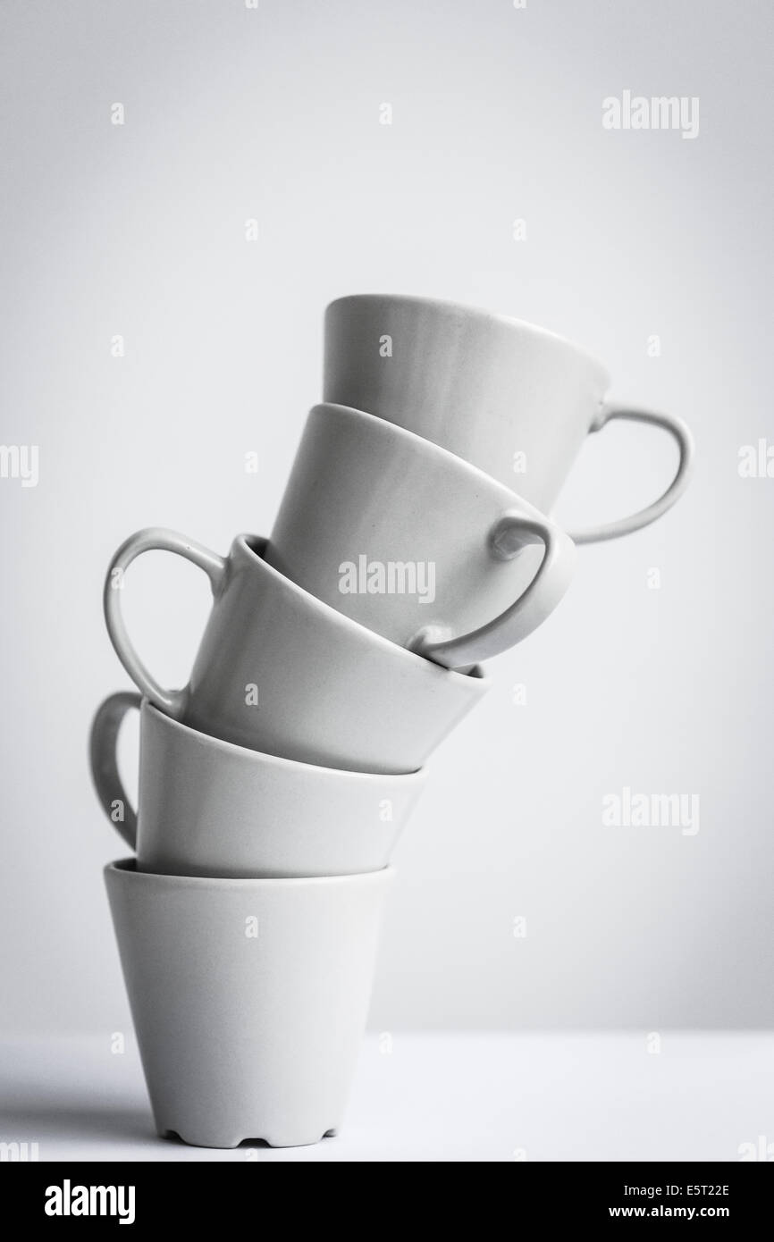 Stacked cups illustrating excessive consumption of coffee. Stock Photo