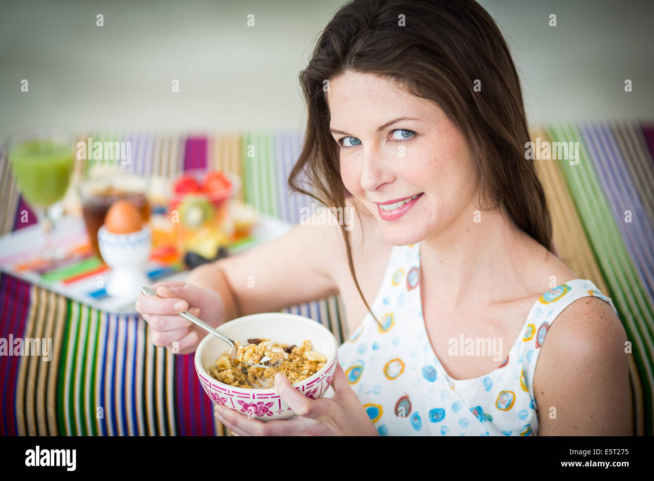 Woman eating muesli Stock Photo Alamy