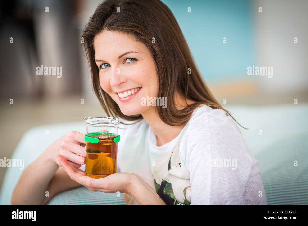 Woman drinking hot beverage Stock Photo Alamy