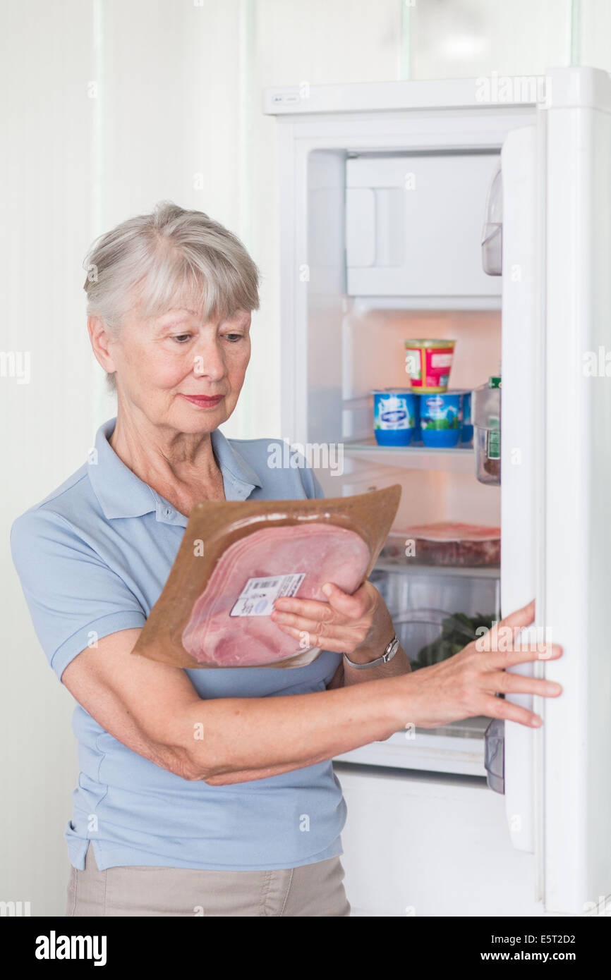 Woman checking the composition and nutrition facts. Stock Photo