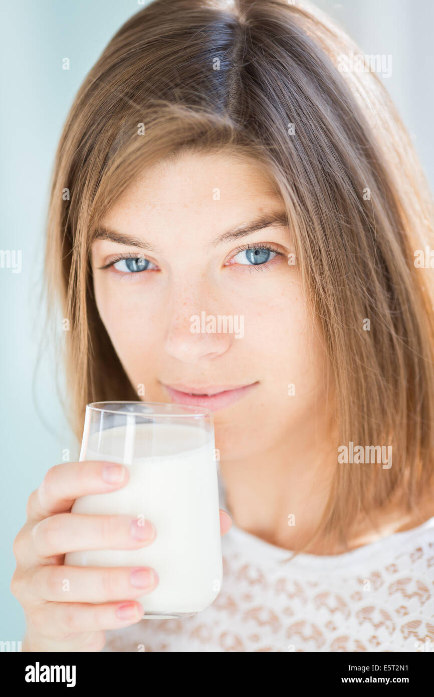 Woman drinking a glass of milk Stock Photo Alamy