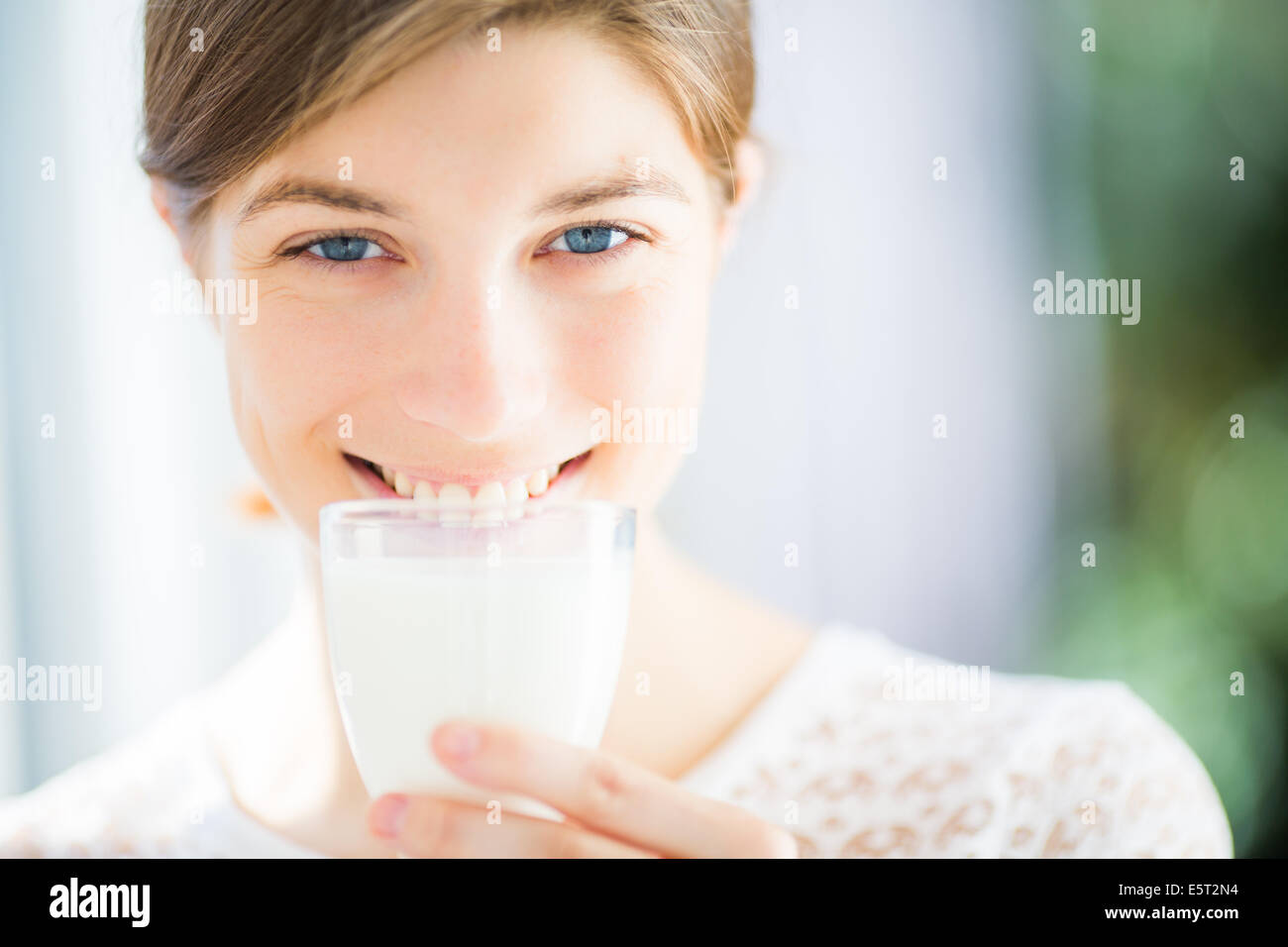 Woman drinking a glass of milk Stock Photo Alamy