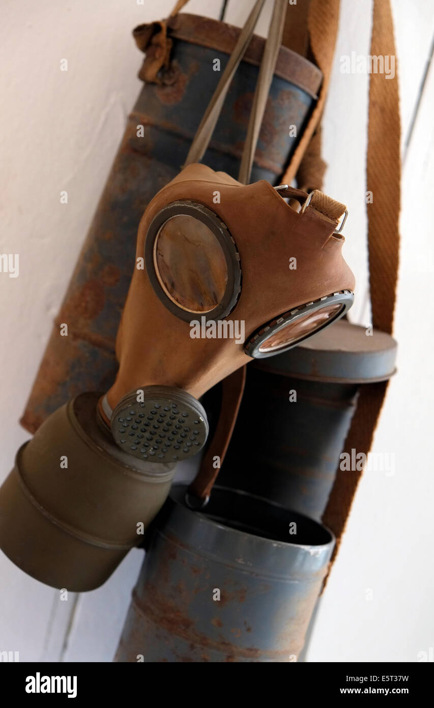 gas mask hanging on wall Stock Photo