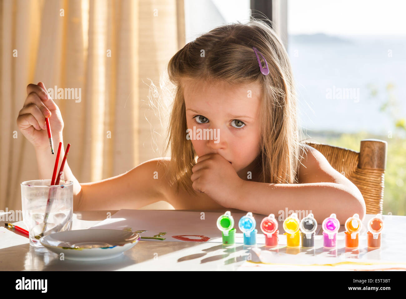 4 year old girl painting. Stock Photo