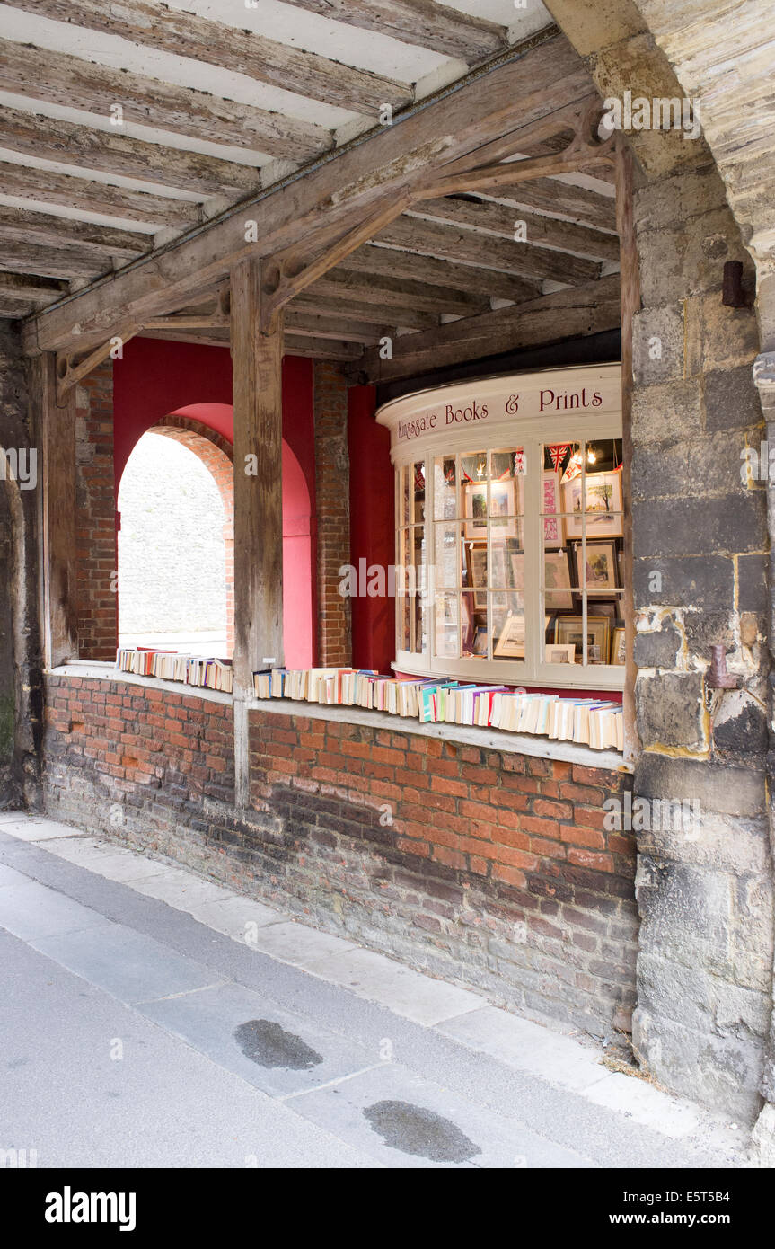 Kingsgate with second hand books displayed on top of wall in