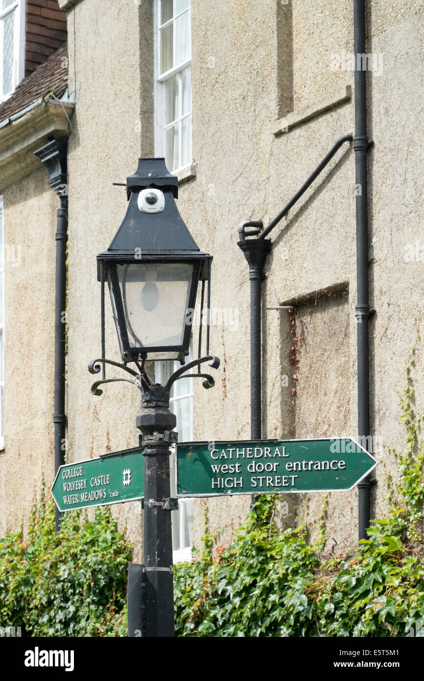 Small CCTV camera mounted in the top of a street lamp Stock Photo