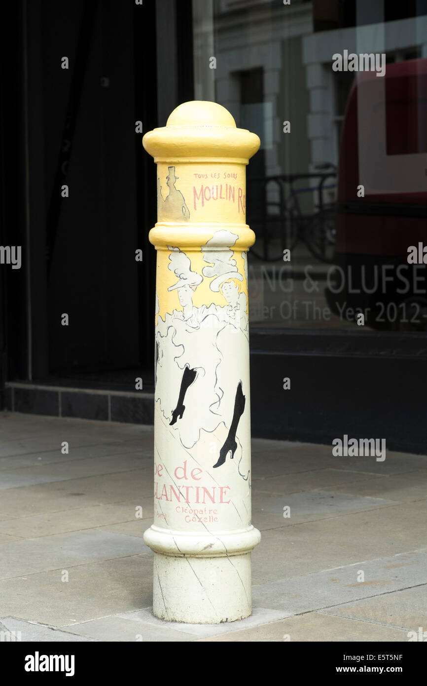 Hand painted decorated metal pavement bollard in Winchester Hampshire UK Stock Photo
