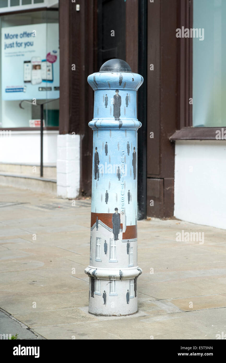 Hand painted decorated metal pavement bollard in Winchester Hampshire UK Stock Photo