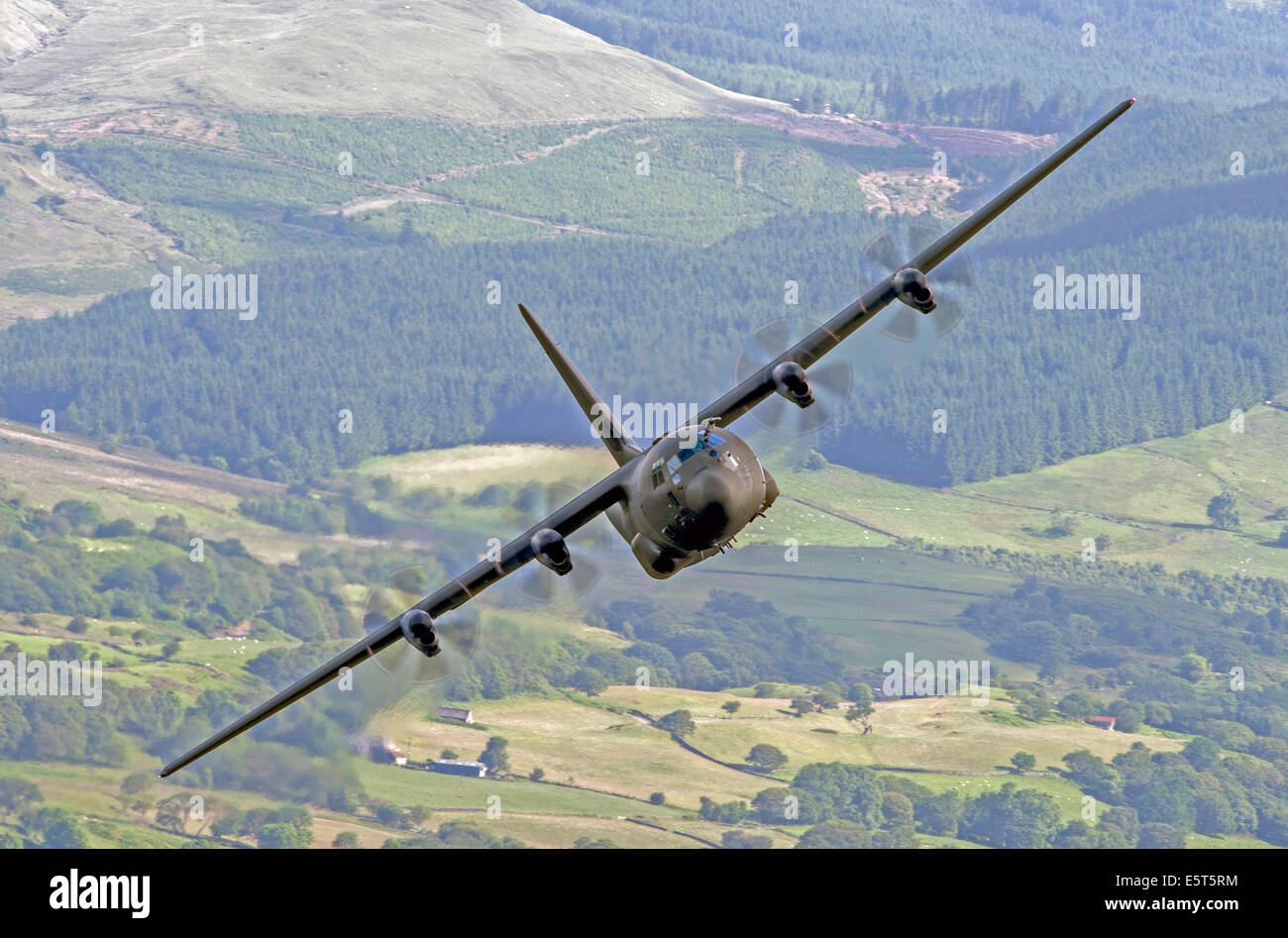 RAF C-130 Hercules flying low level in the Mach Loop area of Wales Stock Photo