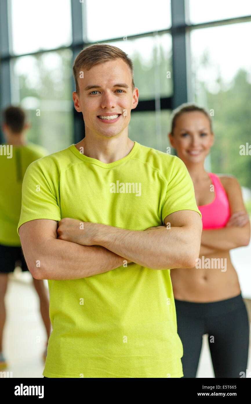 smiling man and woman in gym Stock Photo - Alamy