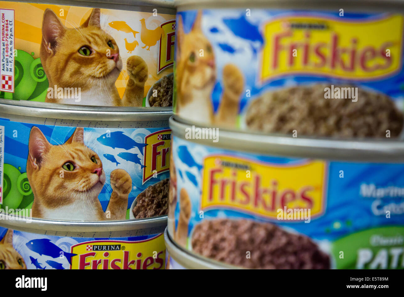 Cans of Friskies cat food in an assortment of yummy flavors on a