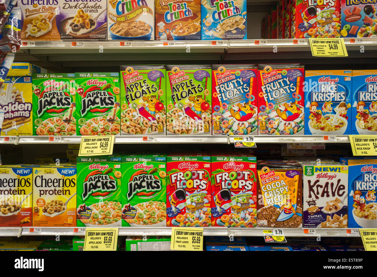 Boxes of Kellogg's breakfast cereals with generic brands mixed in on grocery store shelves in New York Stock Photo