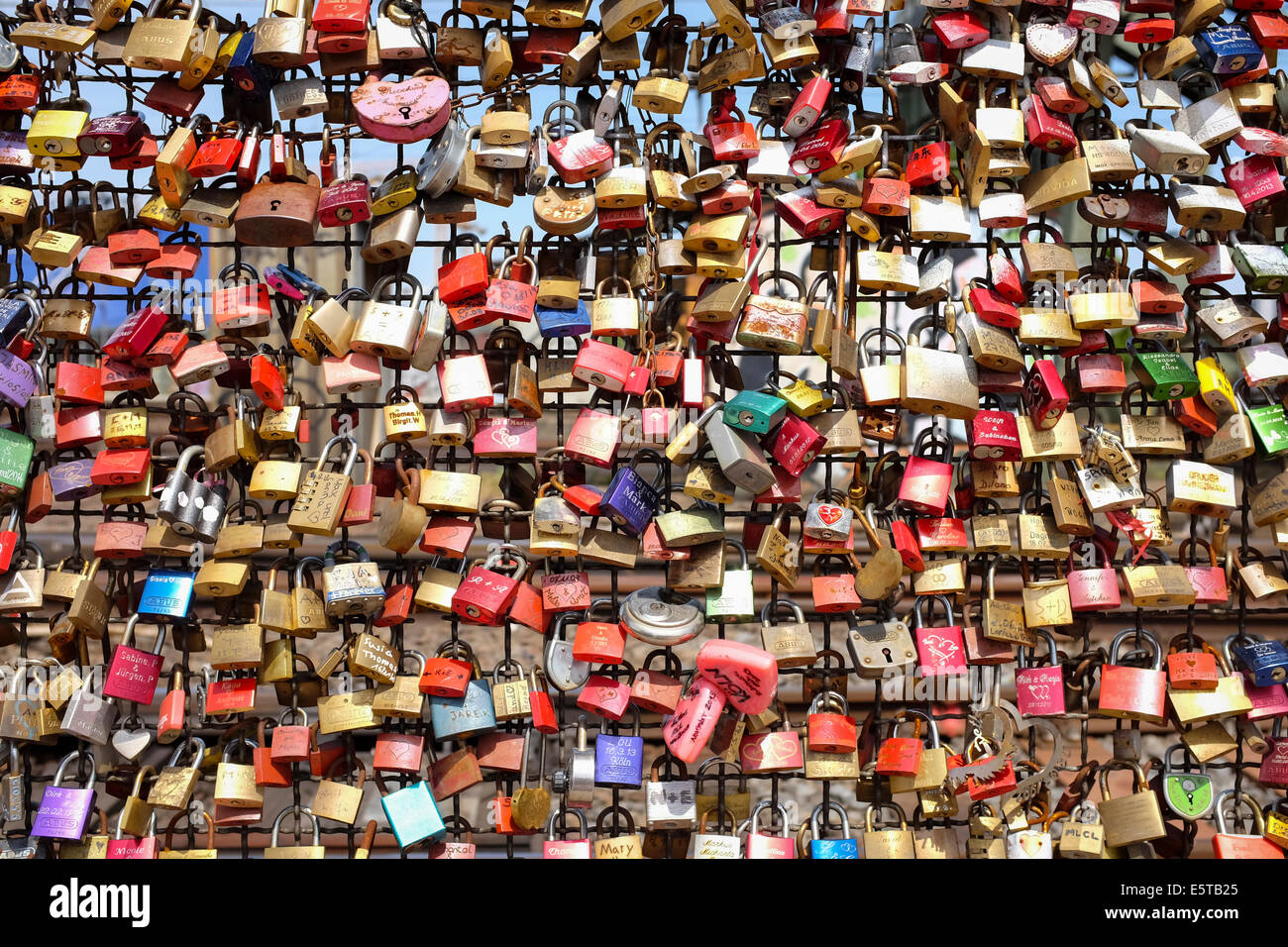 Padlocks symbolizing love forever on the wall of love in the Hohenzollern Bridge in Cologne, Germany Stock Photo