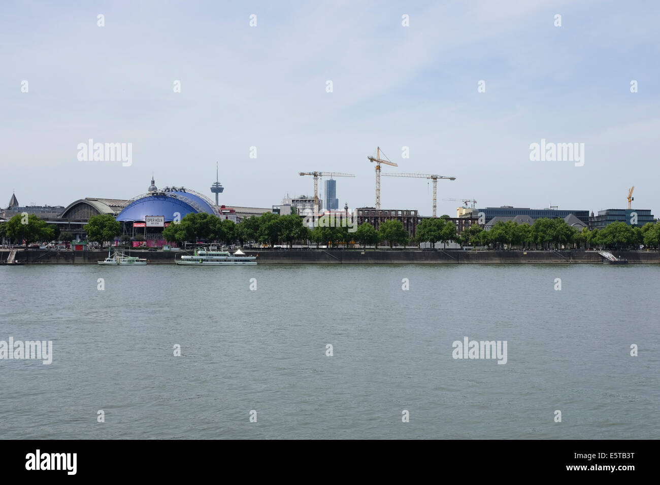 Cranes standing out the River Rhine riverside in Cologne, Germany Stock Photo