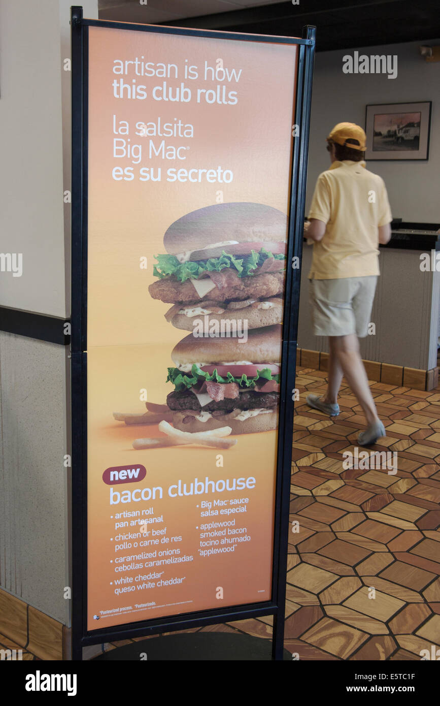English and Spanish sign in a McDonald's Restaurant. Stock Photo