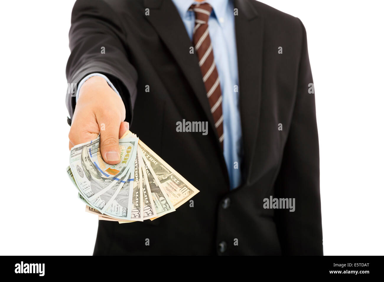 business man displaying a spread of us dollar cash Stock Photo