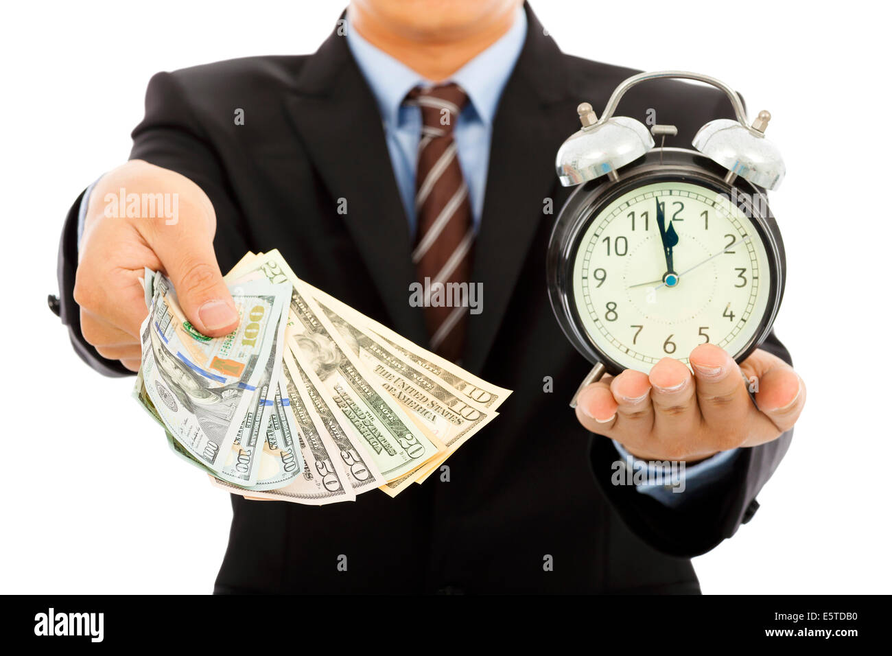 businessman holding money and clock. time is money concept Stock Photo