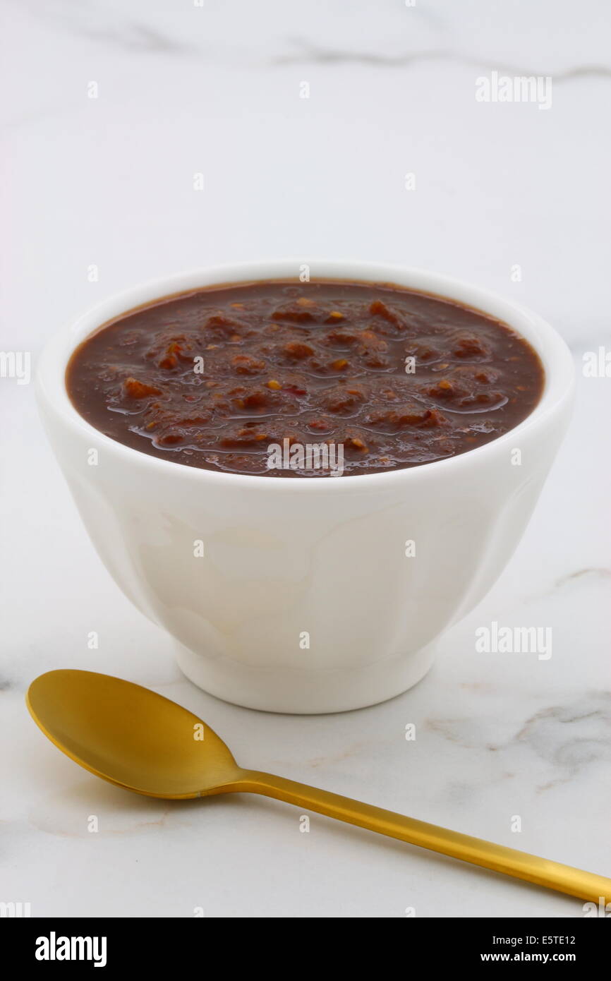 Artisan mexican chipotle sauce on vintage carrara marble table, with a delicious smoky flavor perfect for all your Mexican, tex- Stock Photo