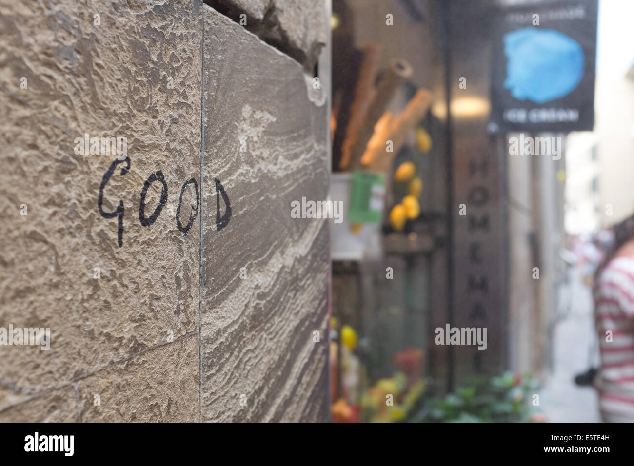 Graffiti 'good' on a wall in Florence Italy Stock Photo