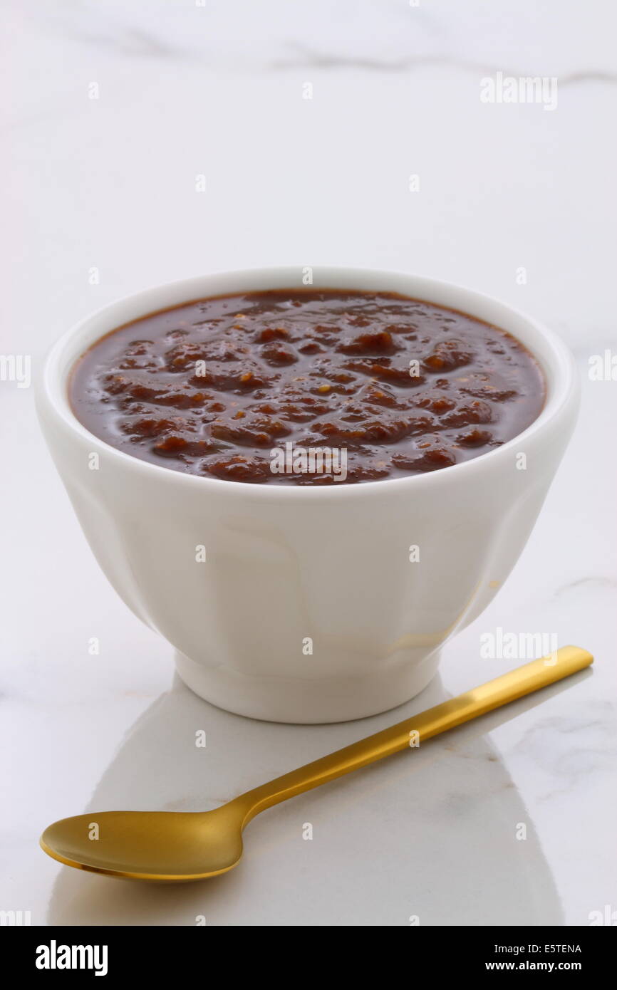 Artisan mexican chipotle sauce on vintage carrara marble table, with a delicious smoky flavor perfect for all your Mexican, tex- Stock Photo