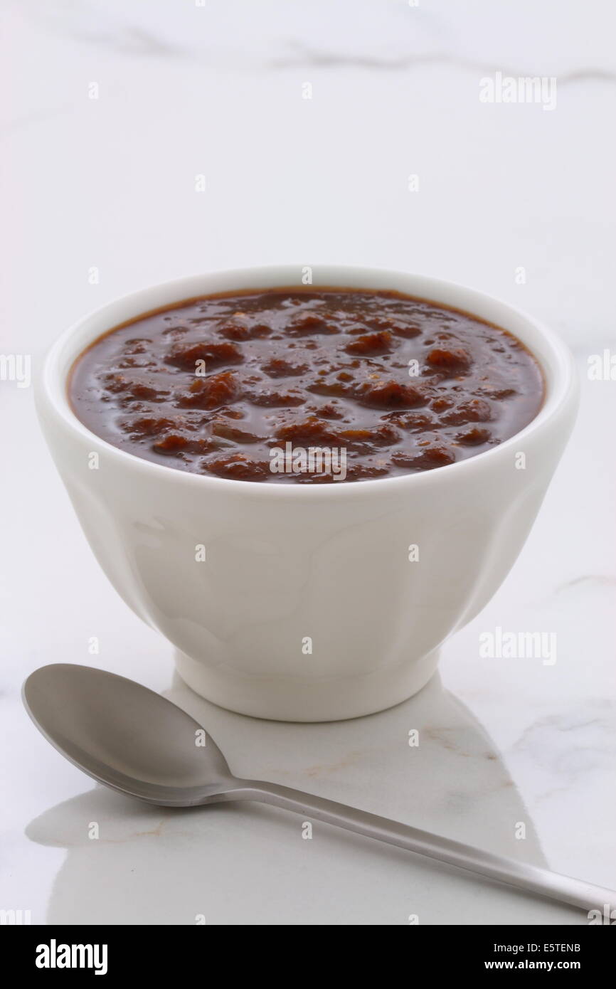Artisan mexican chipotle sauce on vintage carrara marble table, with a delicious smoky flavor perfect for all your Mexican, tex- Stock Photo