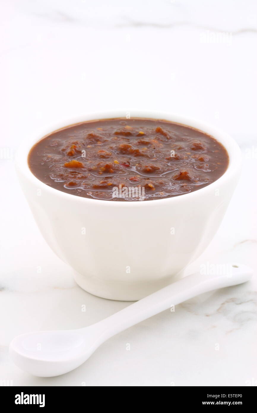 Artisan mexican chipotle sauce on vintage carrara marble table, with a delicious smoky flavor perfect for all your Mexican, tex- Stock Photo