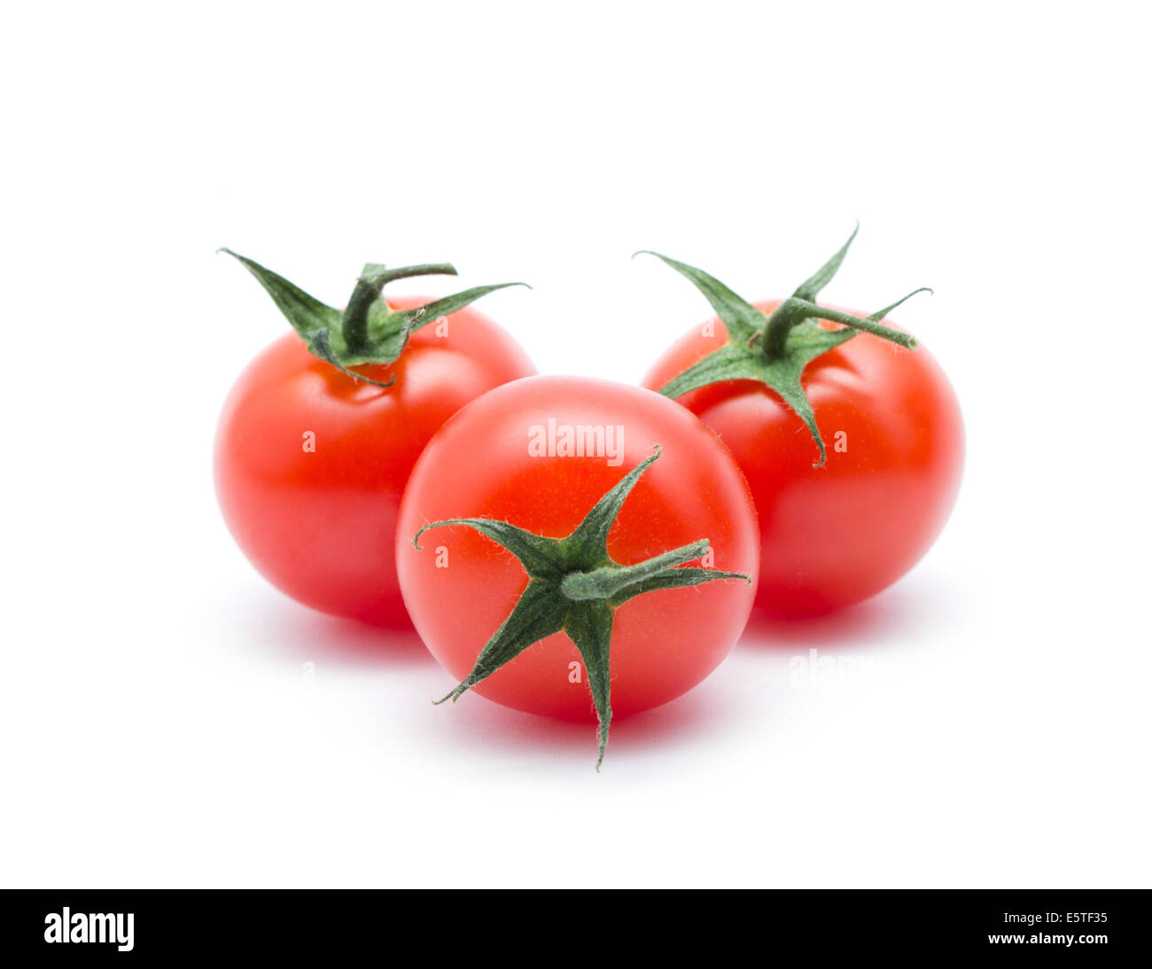 Cherry tomatoes on white Stock Photo