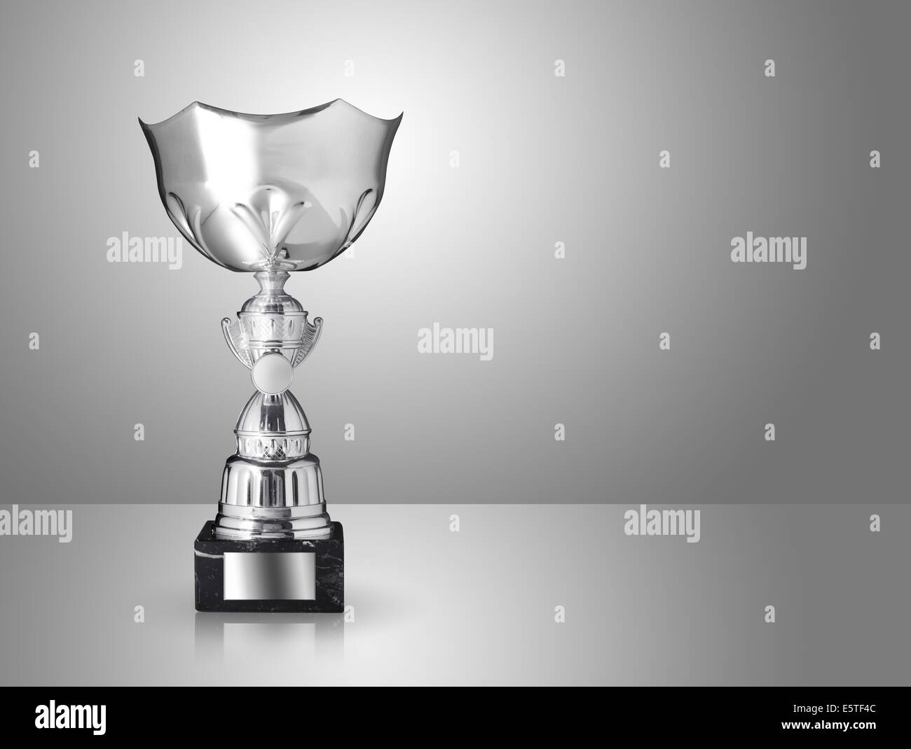 champion silver trophy on gray background Stock Photo