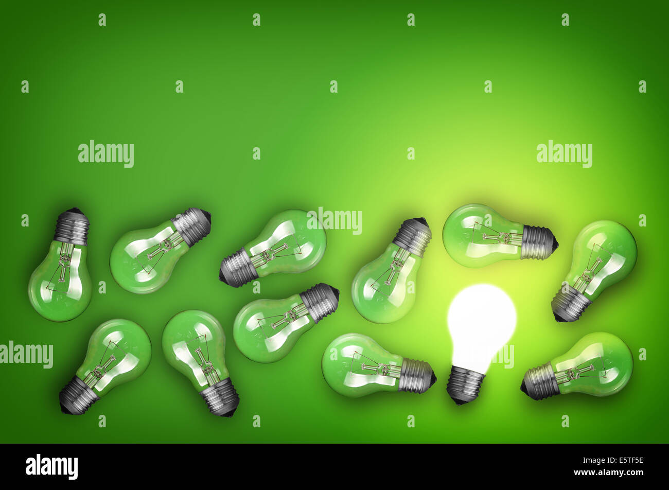 Idea concept with row of light bulbs and glowing bulb Stock Photo