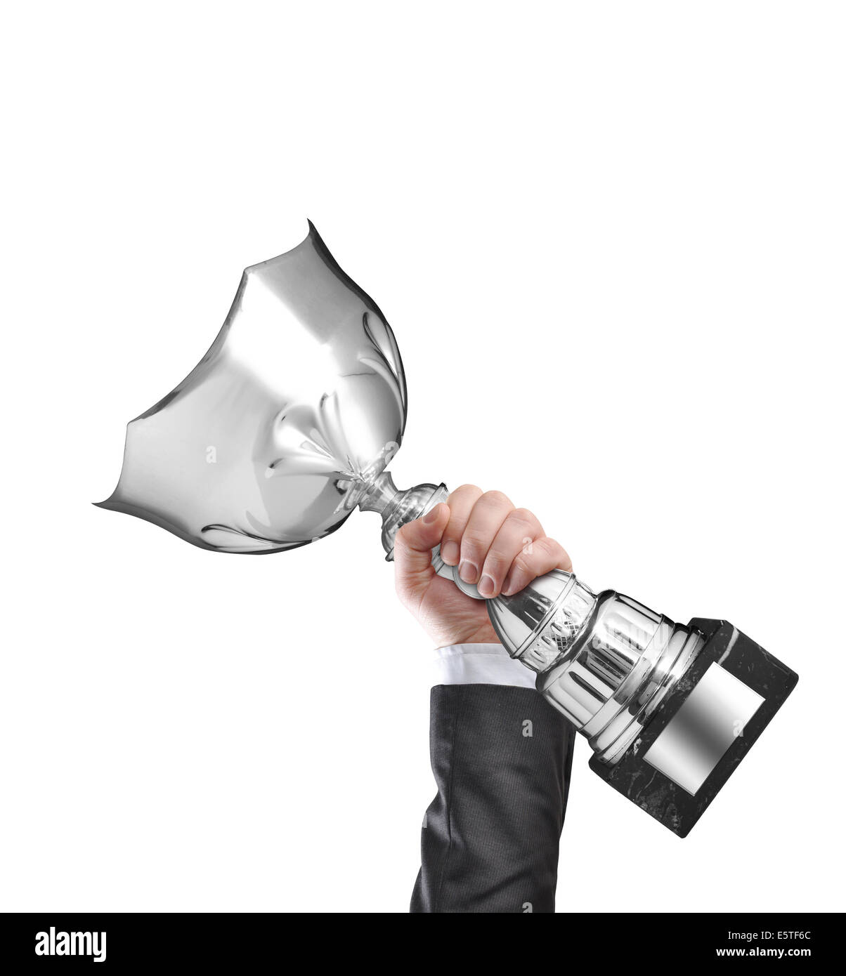 Businessman holding a champion silver trophy Stock Photo