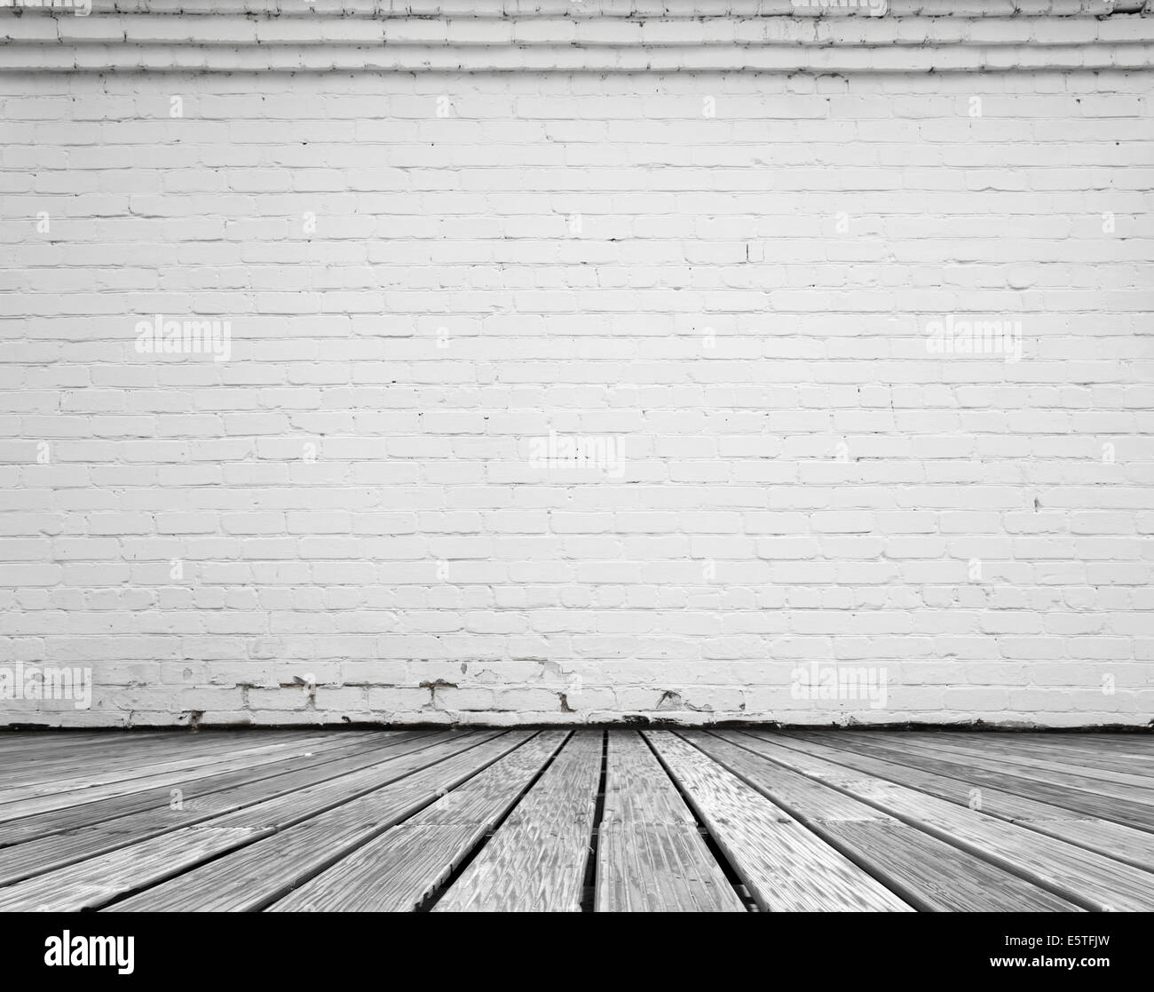 interior room with white brick wall and wooden floor Stock Photo - Alamy