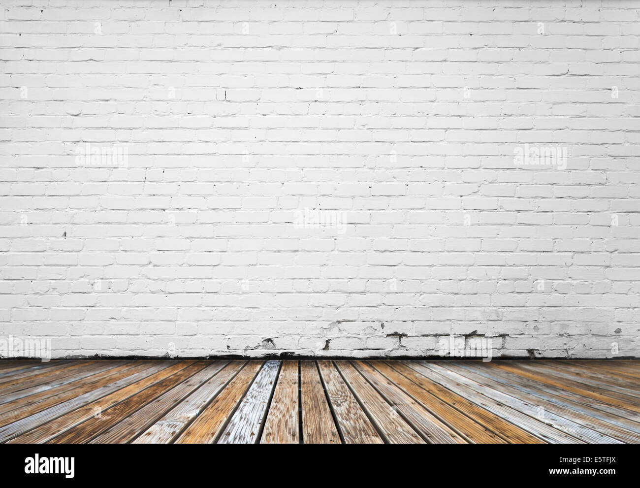 interior room with white brick wall and wooden floor Stock Photo - Alamy
