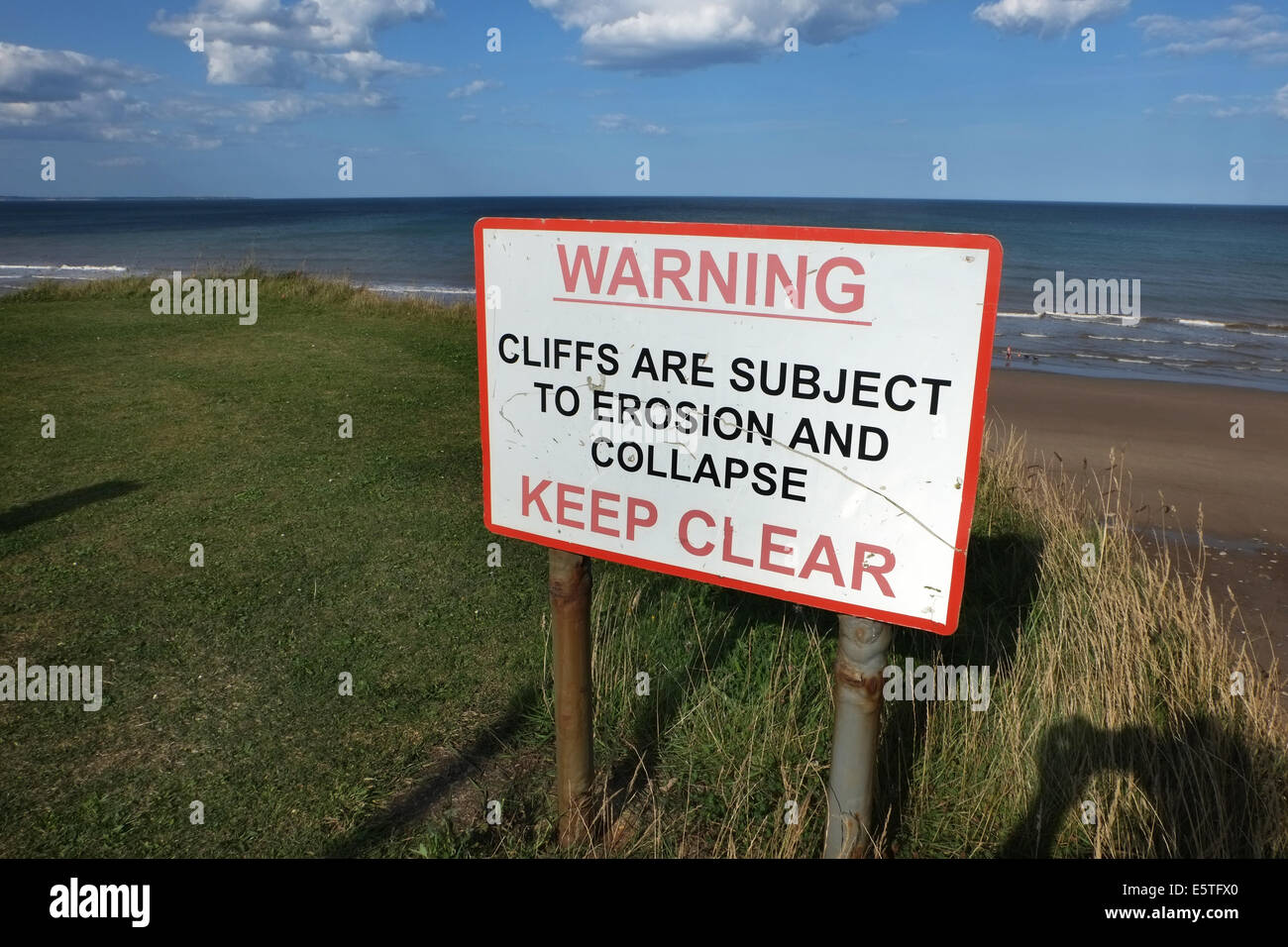 Cliff erosion warning danger sign. Stock Photo