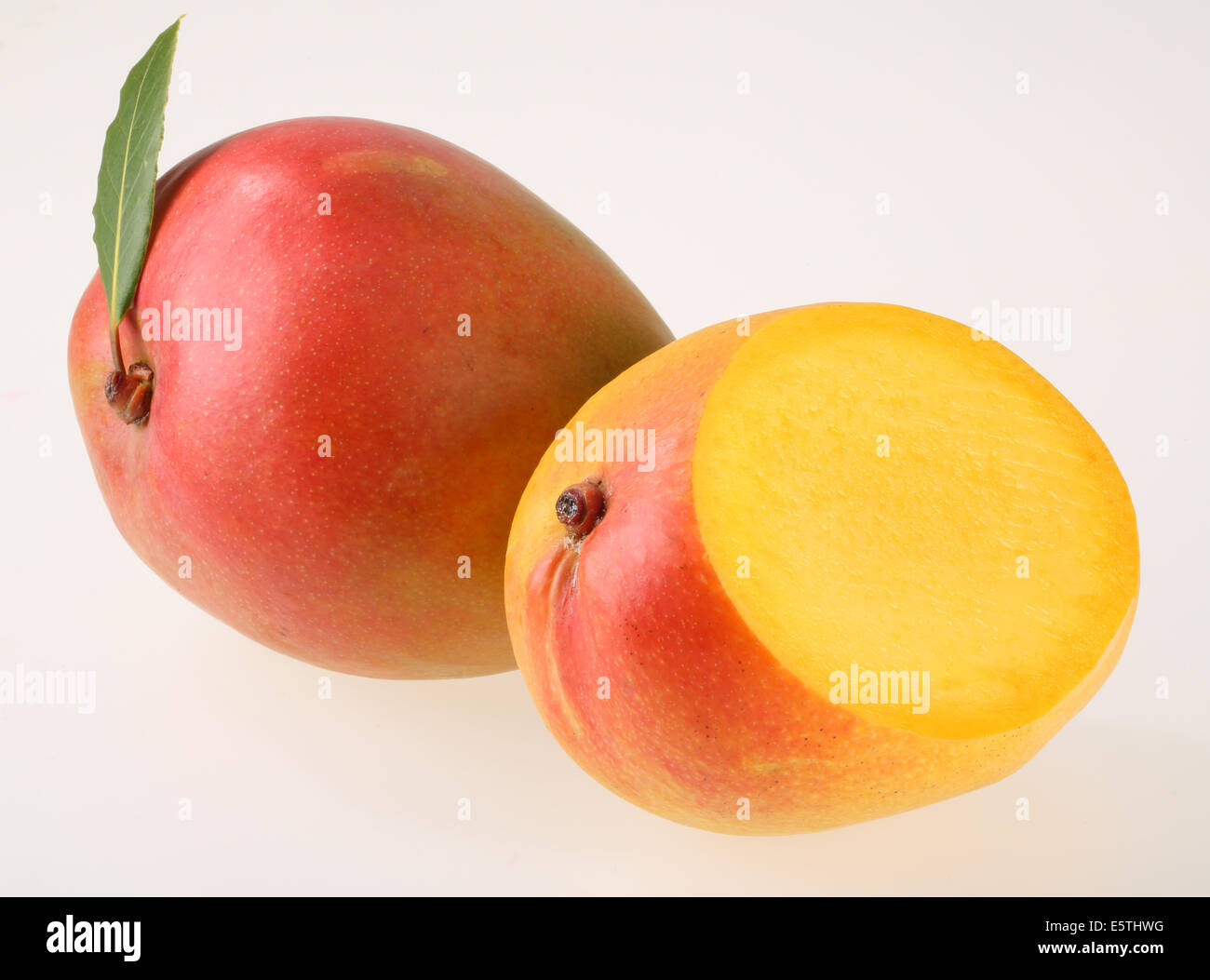 WHOLE HALF AND SLICED  MANGO Stock Photo