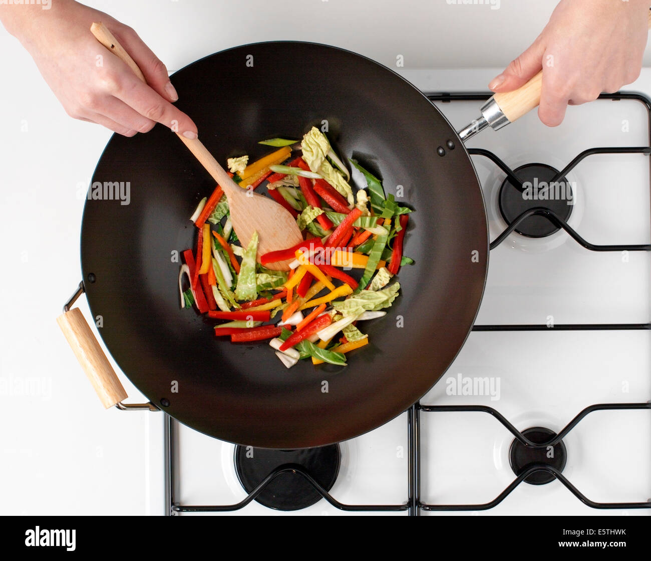 Stir frying in wok hi-res stock photography and images - Alamy