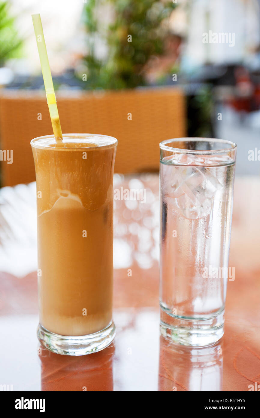 Glasses of frappe coffee and water Stock Photo