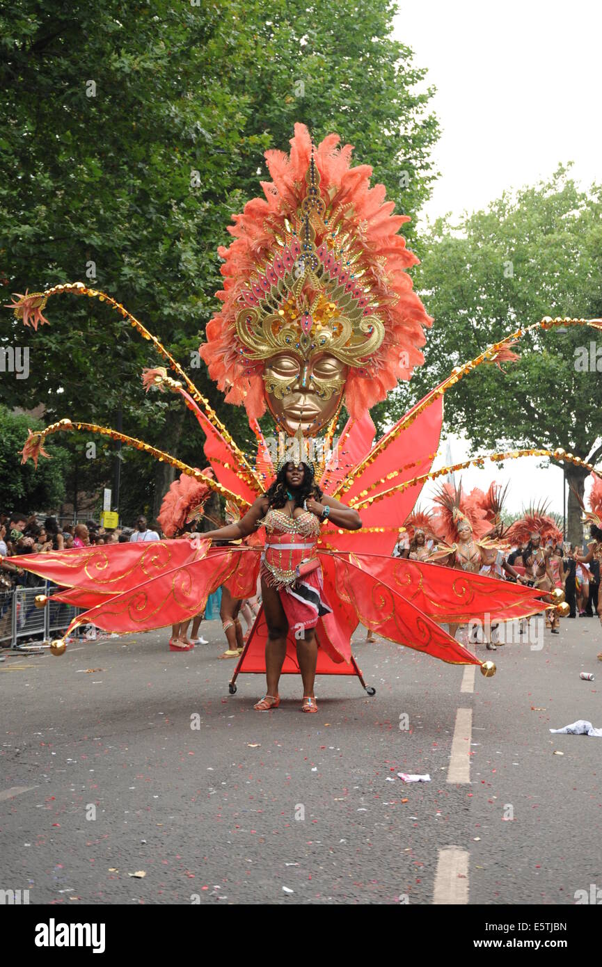 Notting Hill Carnival participants wearing traditional Caribbean costumes Stock Photo