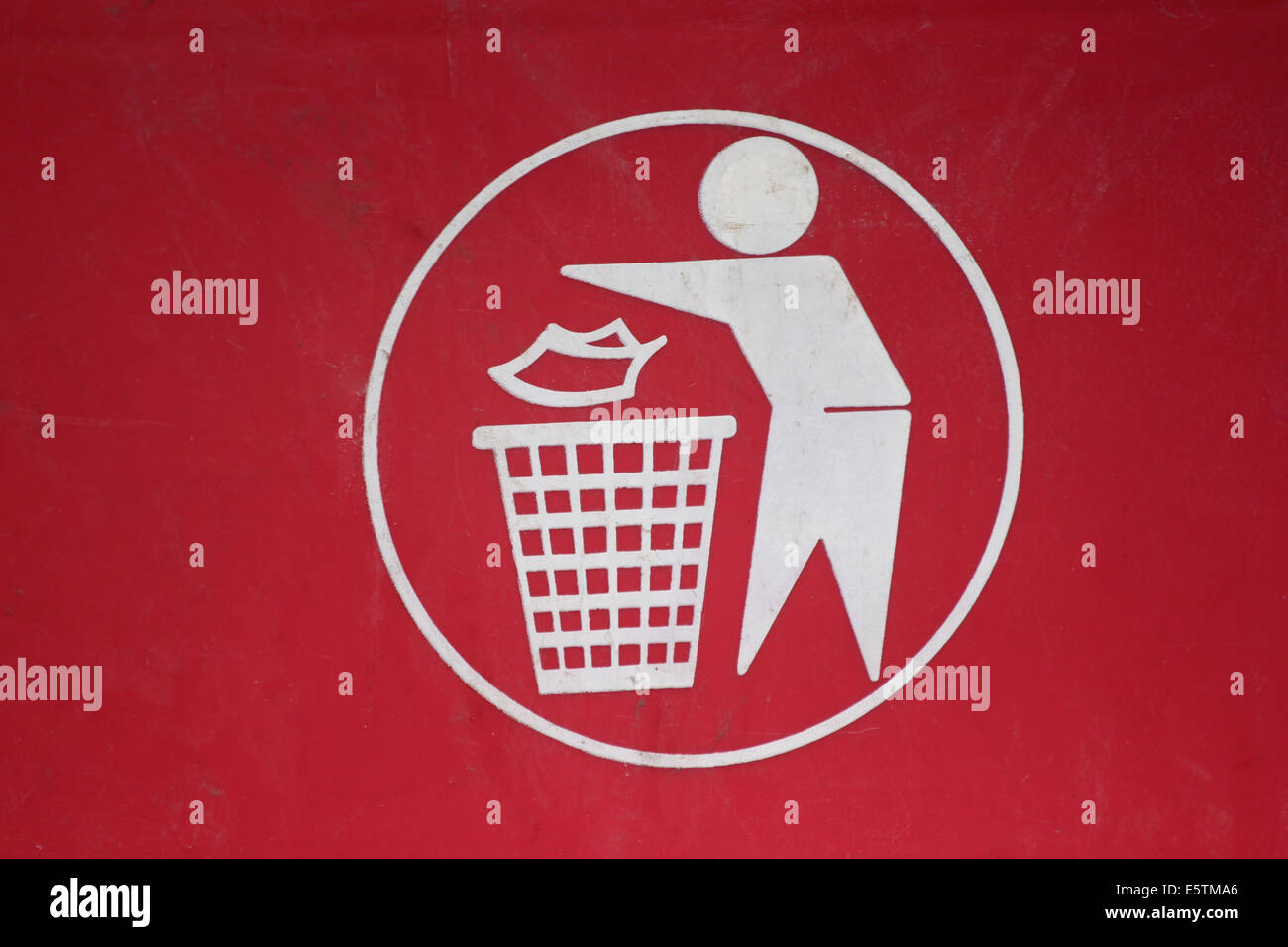 Symbol of waste disposal in to a bin. Stock Photo