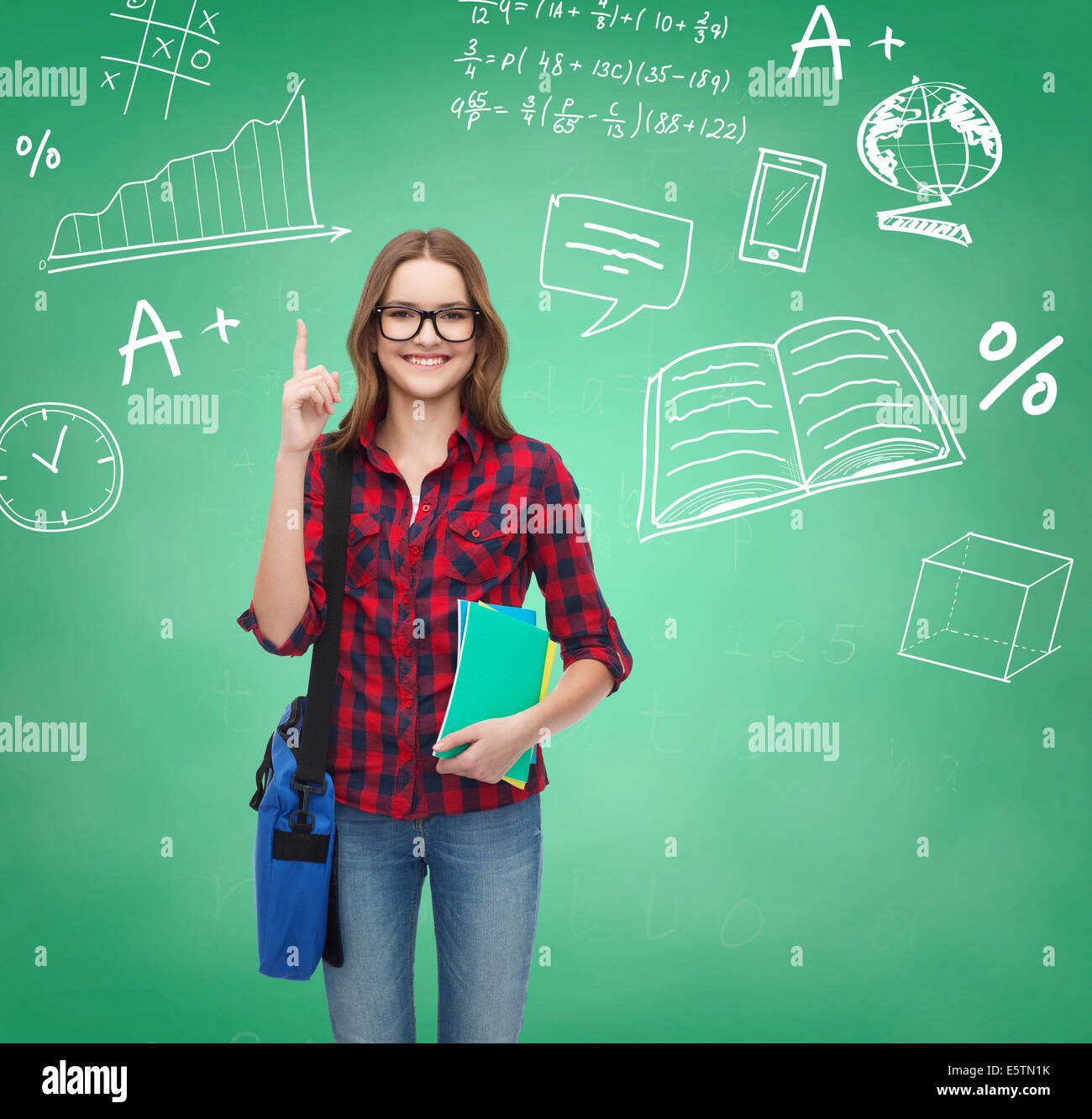 smiling student girl showing thumbs up Stock Photo - Alamy