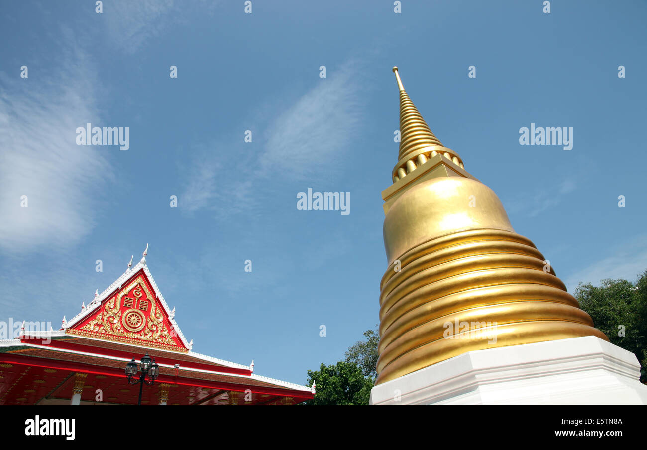 Golden pagoda in Thailand Temple on blue sky background. Stock Photo