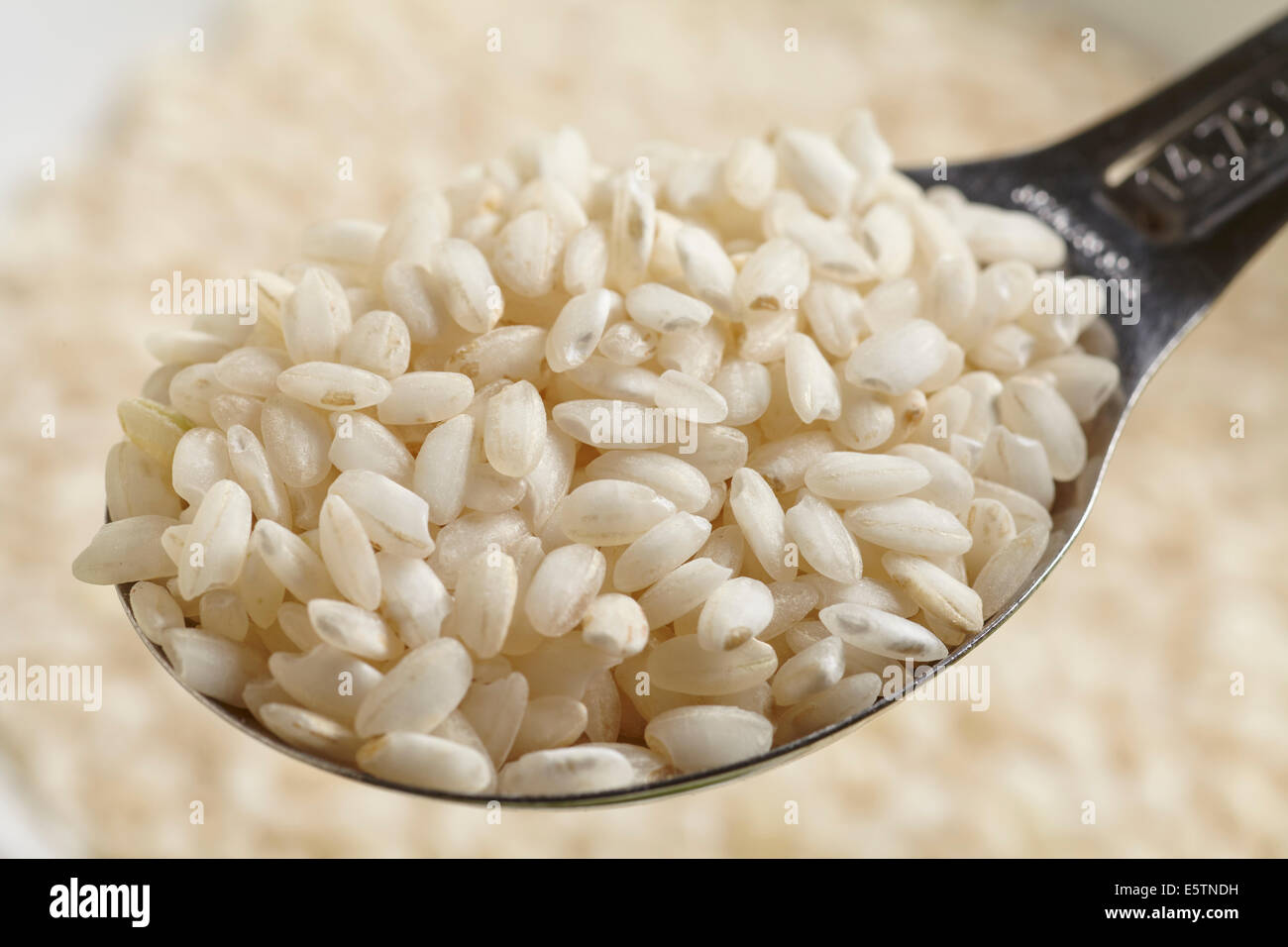 raw uncooked Arborio rice Stock Photo Alamy
