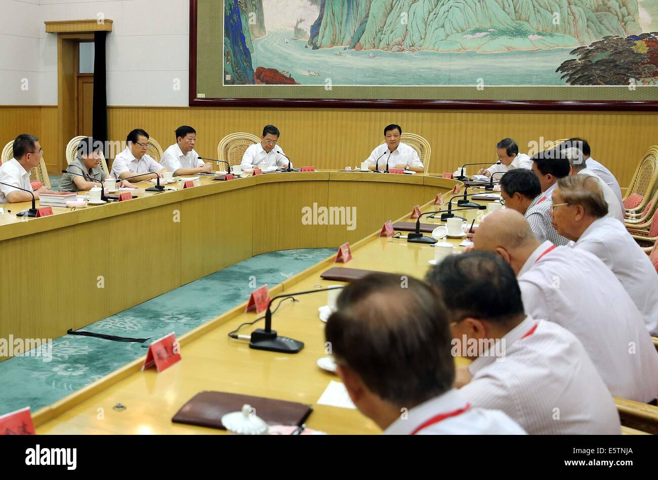 Beidaihe, China's Hebei Province. 6th Aug, 2014. Liu Yunshan (C), a member of the Standing Committee of the Political Bureau of the Communist Party of China (CPC) Central Committee and secretary of the Secretariat of the CPC Central Committee, attends a symposium with scientists and experts in other fields who are enjoying a state-sponsored summer vacation at Beidaihe, a coastal resort in north China's Hebei Province, Aug. 6, 2014. Entrusted by President Xi Jinping, Liu extended greetings and good wishes to the experts at the symposium. Credit:  Liu Weibing/Xinhua/Alamy Live News Stock Photo