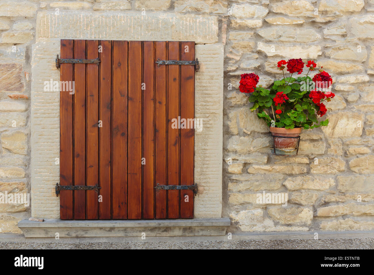 Window in an old house decorated with flower pots and flowers Stock ...