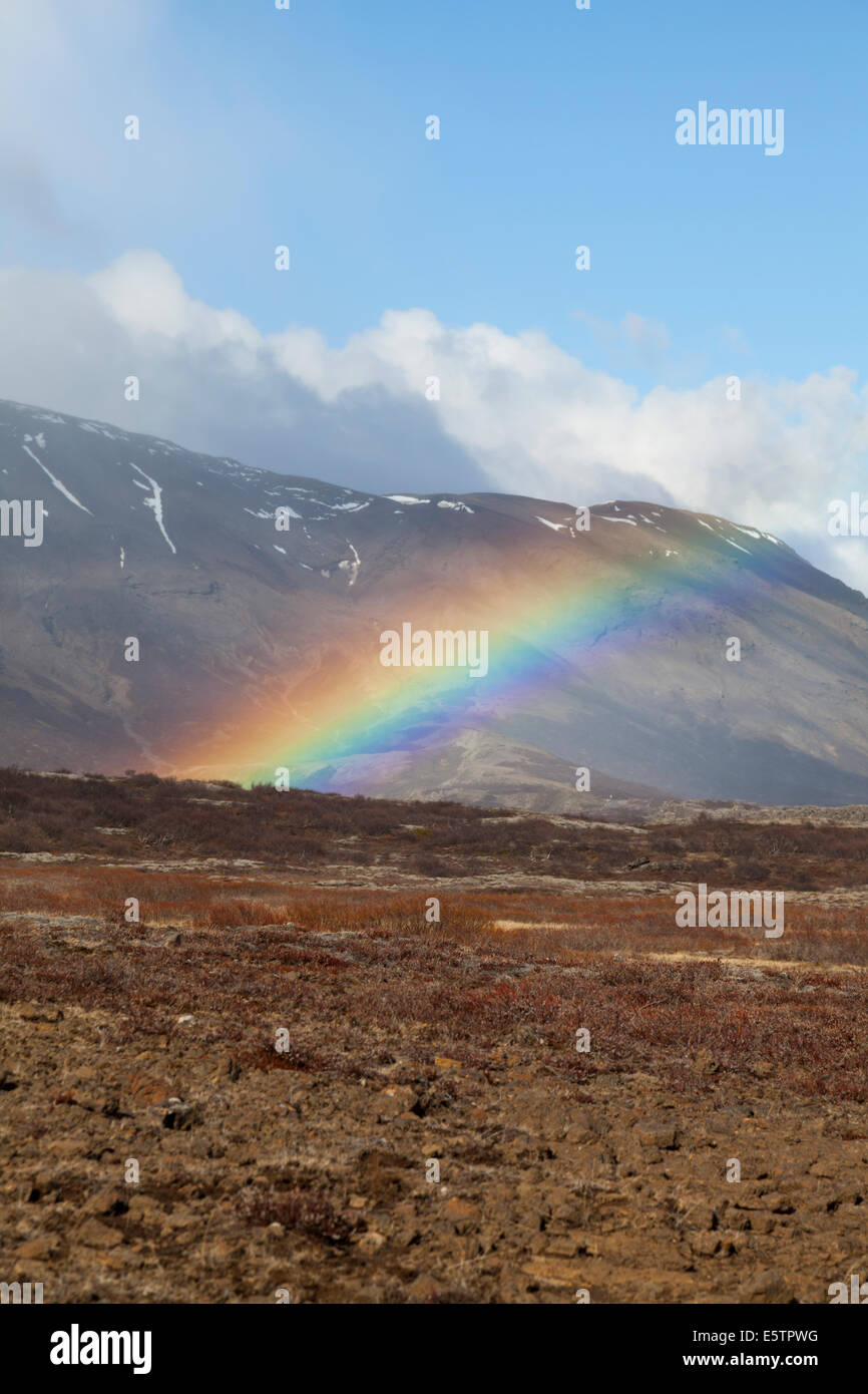 Colorful rainbow stretching across the landscape in southwest Iceland Stock Photo