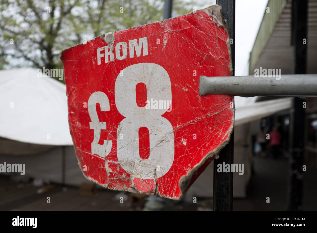 market Stall price sign from £ 8 old tatty worn Stock Photo