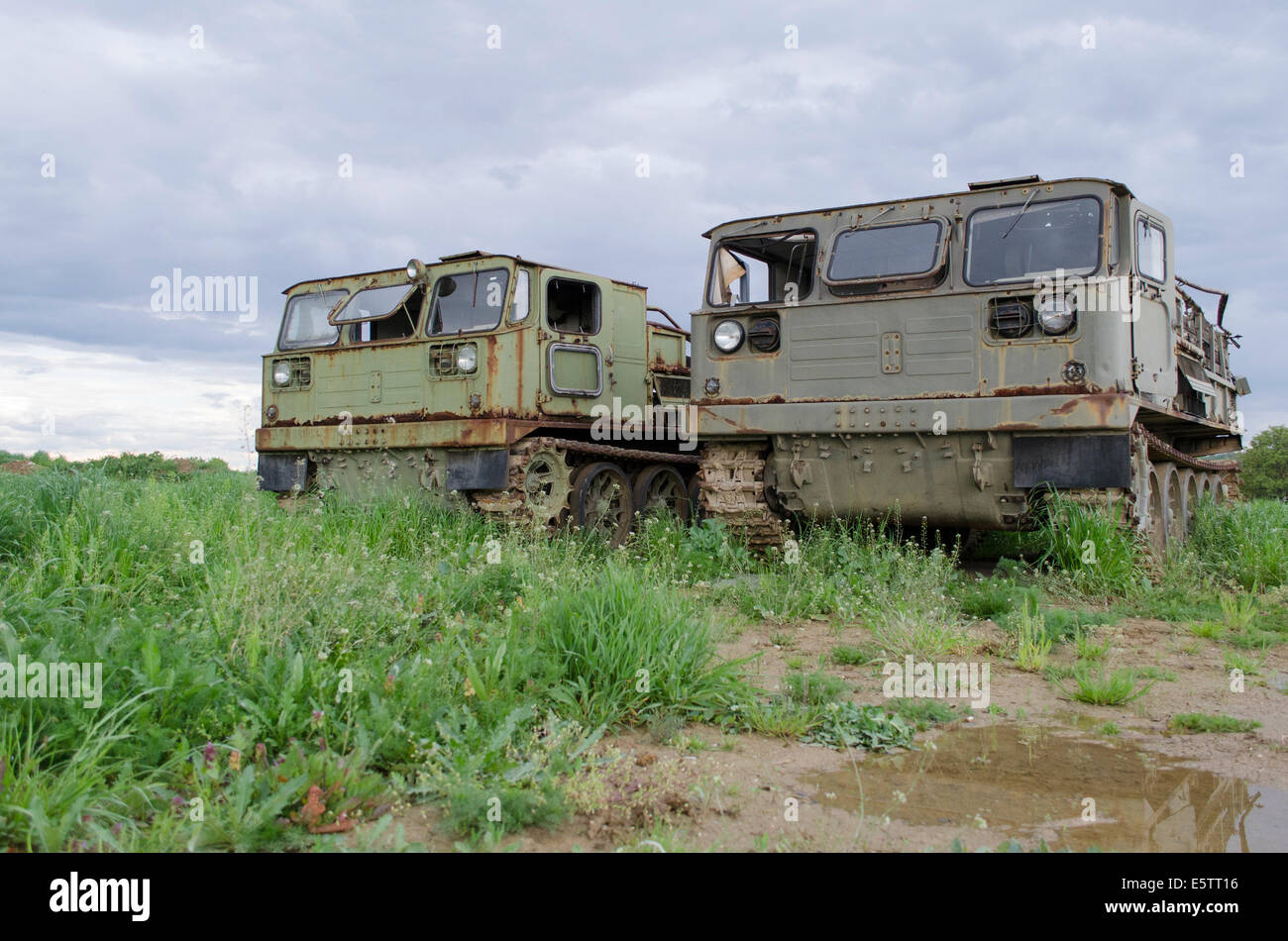A pair of Russian made military vehicles rusting away after their service had been finished. Stock Photo