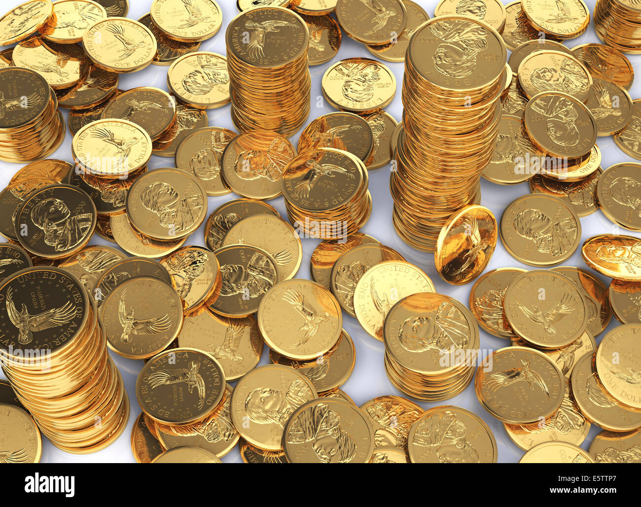Gold dollar coins spread on a white surface and few stacks between them. Stock Photo